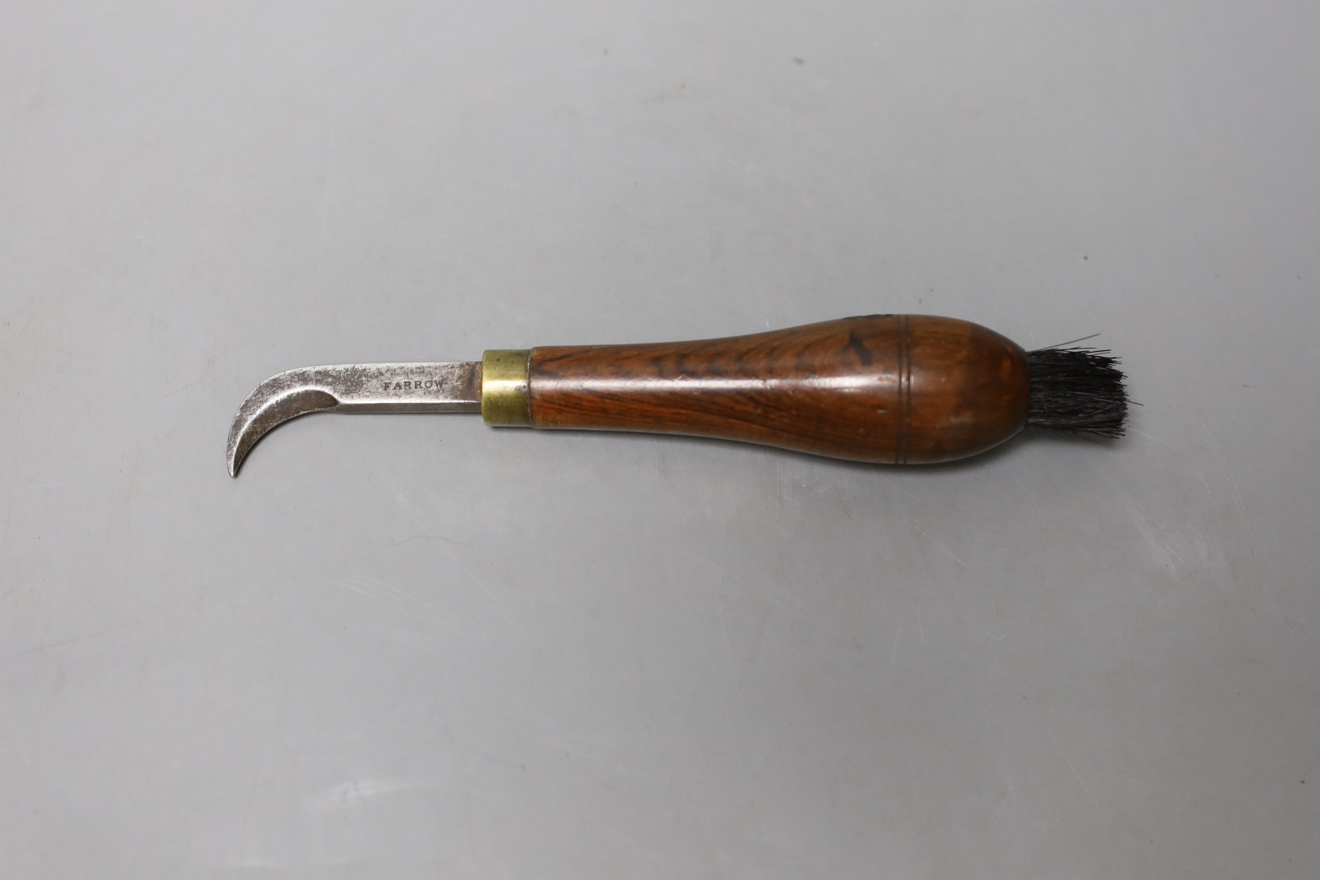 A Farrow bottle seal cutter and brush